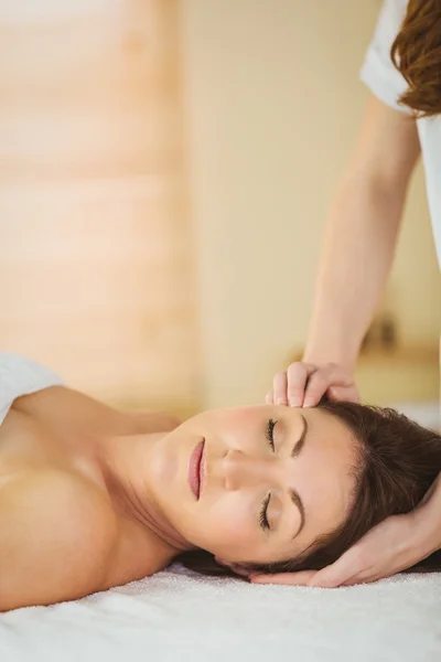 Woman getting herbal compress massage — Stock Photo, Image