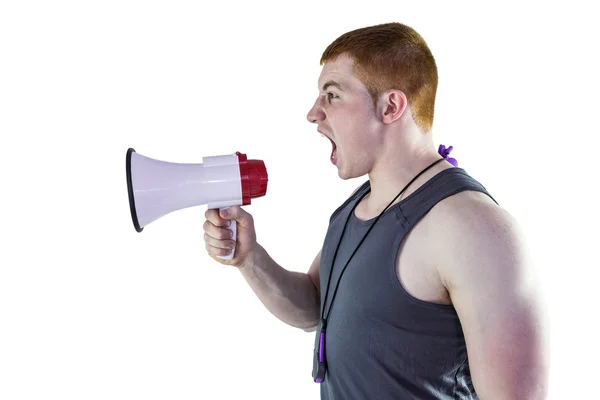 Angry personal trainer yelling through megaphone — Stock Photo, Image