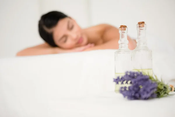 Two massage oil bottles and lavender — Stock Photo, Image