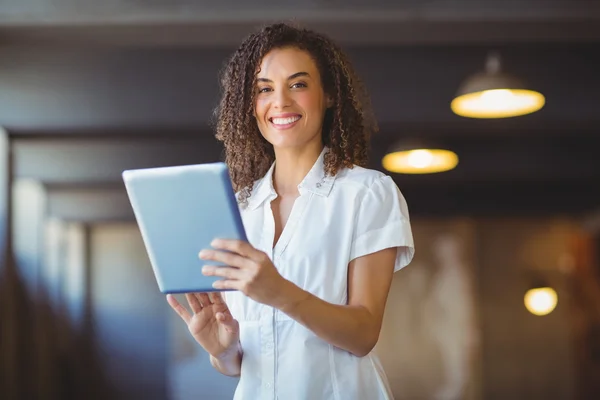 Smiling woman using a digital tablet — Stock Photo, Image