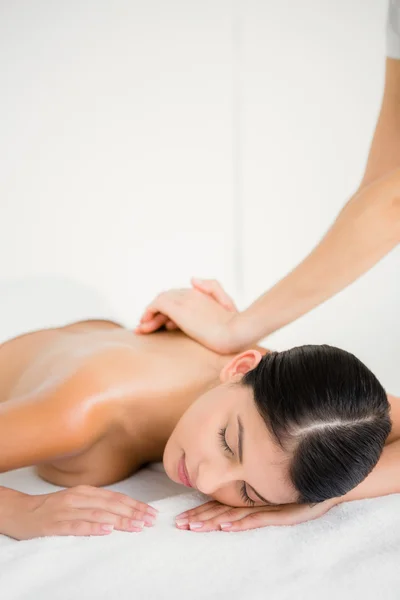 Brunette enjoying massage at spa — Stock Photo, Image