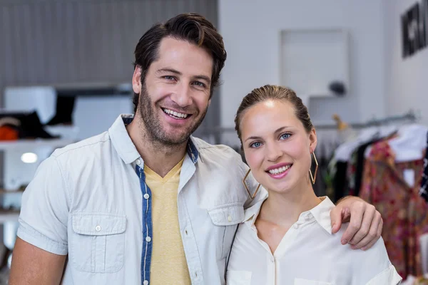 Couple smiling in clothing store — Stock Photo, Image