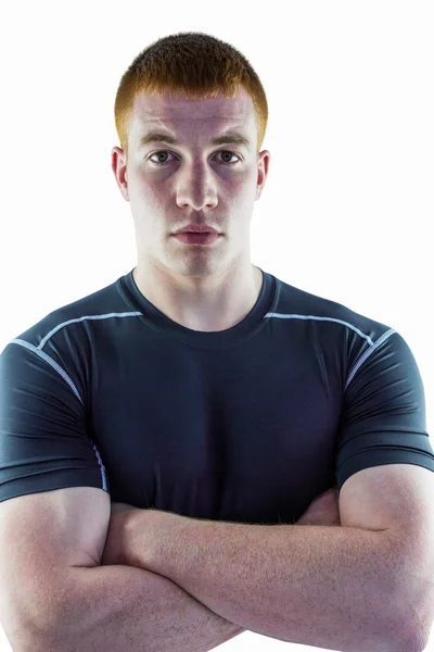 Muscular rugby player with arms crossed — Stock Photo, Image