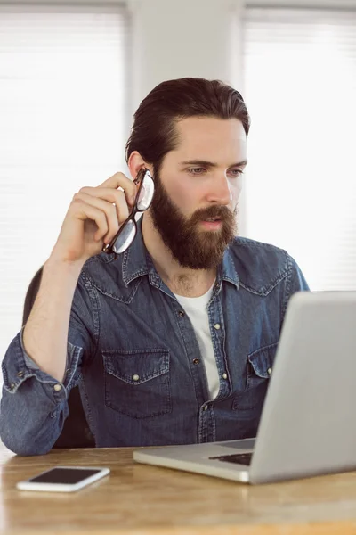 Hipster businessman working on his laptop — Stock Photo, Image