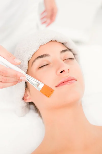 Attractive young woman receiving massage — Stock Photo, Image