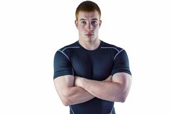 Jogador de rugby muscular com braços cruzados — Fotografia de Stock