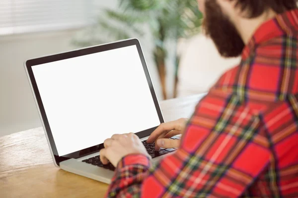 Hipster businessman working on his laptop — Stockfoto