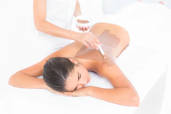 Brunette enjoying chocolate beauty treatment — Stock Photo, Image