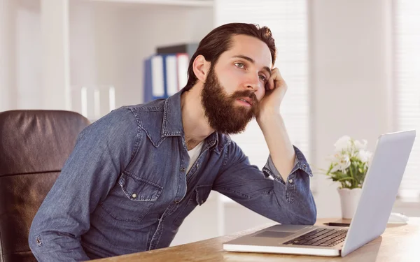 Hipster businessman bored at his desk — Stok fotoğraf