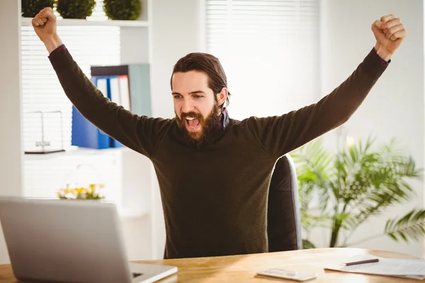 Hipster businessman cheering at his desk — Stock Photo, Image