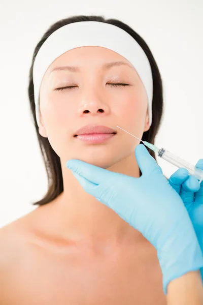 Woman receiving botox injection on lips — Stock Photo, Image