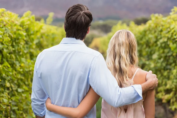 Young happy couple having an arm around each other — Stock Photo, Image