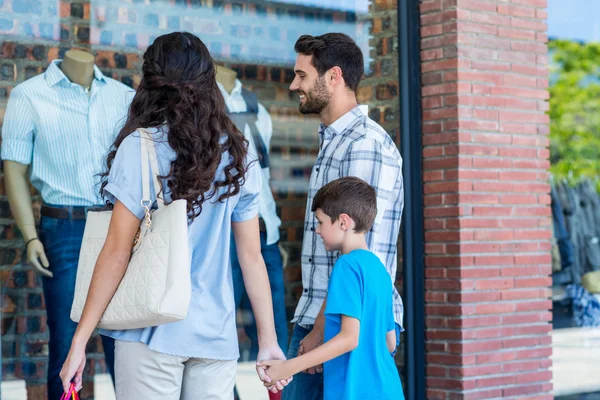 Happy family looking at some article — Stock Photo, Image