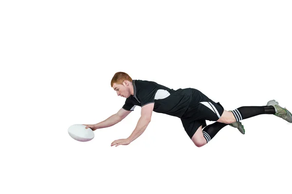 Een rugbyspeler een poging te scoren — Stockfoto