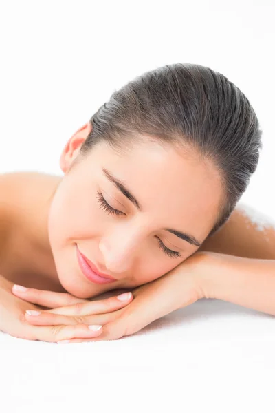 Brunette sleeping after salt scrub treatment — Stock Photo, Image