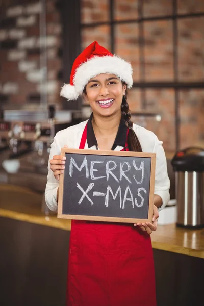 Camarera bonita con una pizarra feliz x-mas —  Fotos de Stock