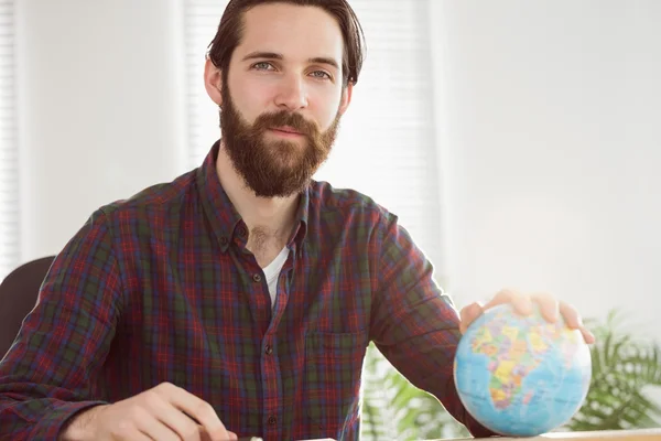 Hipster businessman with a globe — Stock Fotó