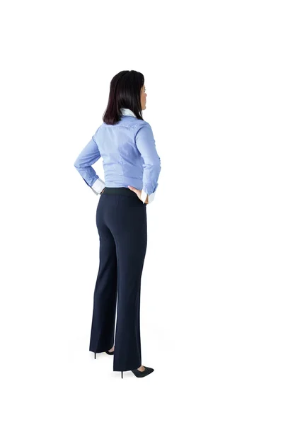 Businesswoman standing with hands on hips — Stock Photo, Image