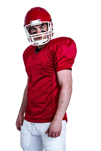 Seriöser amerikanischer Fußballspieler mit Helm — Stockfoto