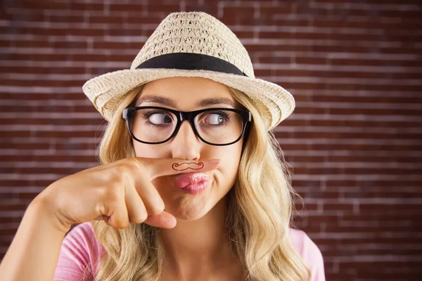 Hipster having a fake mustache — Stock Photo, Image