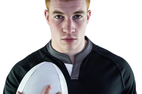 Jugador de rugby sosteniendo una pelota de rugby — Foto de Stock