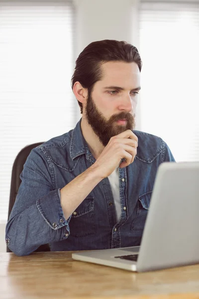 Hipster businessman working on his laptop — Stock Photo, Image