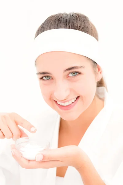 Woman applying cream — Stock Photo, Image