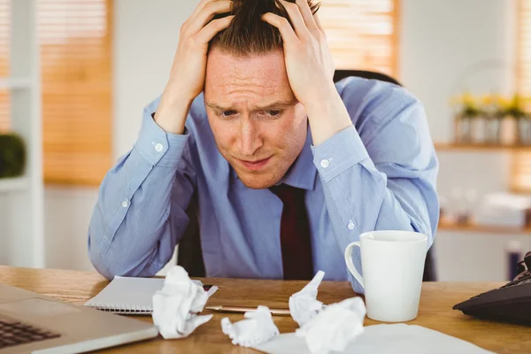 Stressed businessman with head in hands — Stock Photo, Image