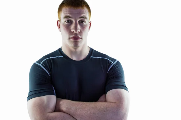 Muskulöser Rugbyspieler mit verschränkten Armen — Stockfoto