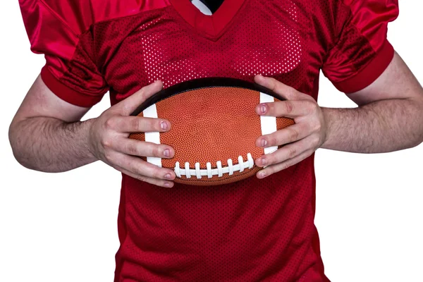 American Football-Spieler hält einen Ball — Stockfoto