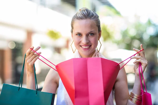 Woman looking into her bag — Stock Photo, Image