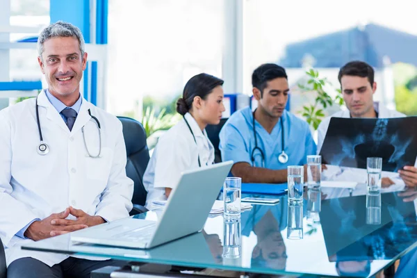 Happy doctor and his colleagues looks at Xray — Stock Photo, Image
