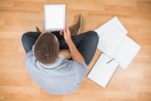 Young creative businessman working on tablet — Stock Photo, Image