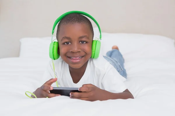 Portrait of a pretty little boy using smartphone — Stock Photo, Image