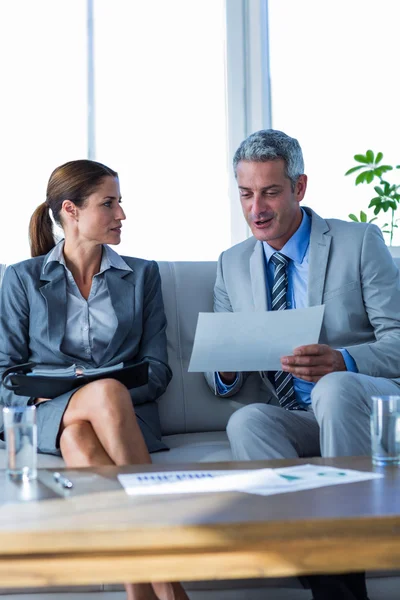 Business people looking at documents — Stock Photo, Image