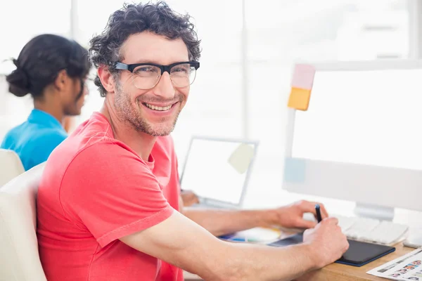 Smiling casual business team working together — Stock Photo, Image