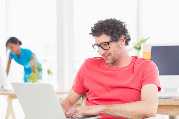 Man posing in front of his colleague — Stock Photo, Image
