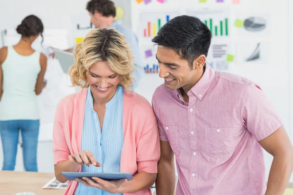 Casual businesspeople using digital tablet — Stock Photo, Image