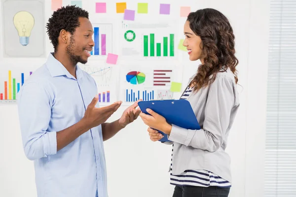 Young creative business people facing each other — Stock Photo, Image