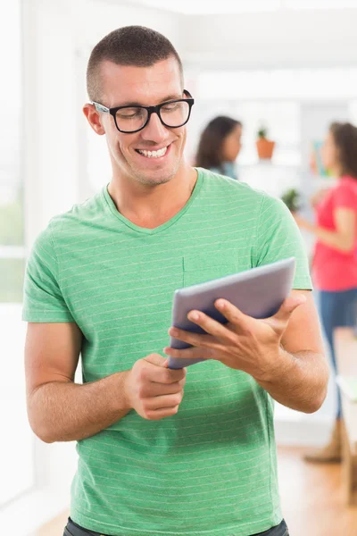 Smiling creative businessman looking at the camera — Stock Photo, Image