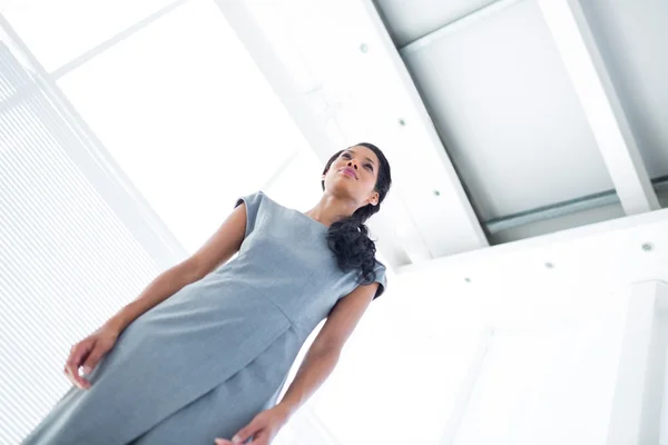 A businesswoman standing in the office — Stock Photo, Image