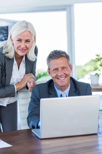 Happy business people looking at camera — Stock Photo, Image