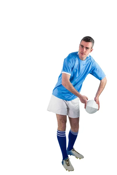 Rugby player about to throw a rugby ball — Stock Photo, Image