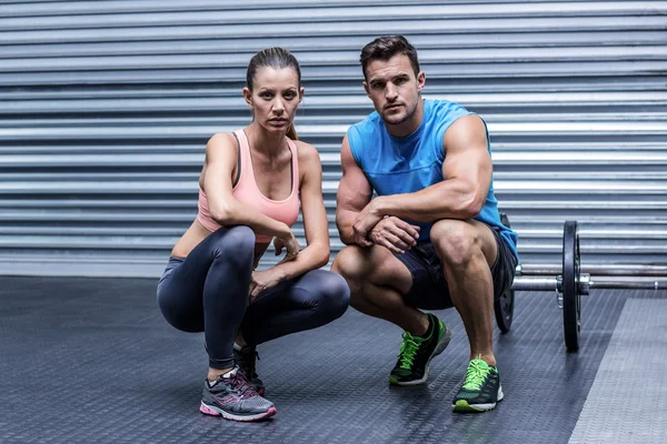 Muscular couple looking at the camera — Stock Photo, Image