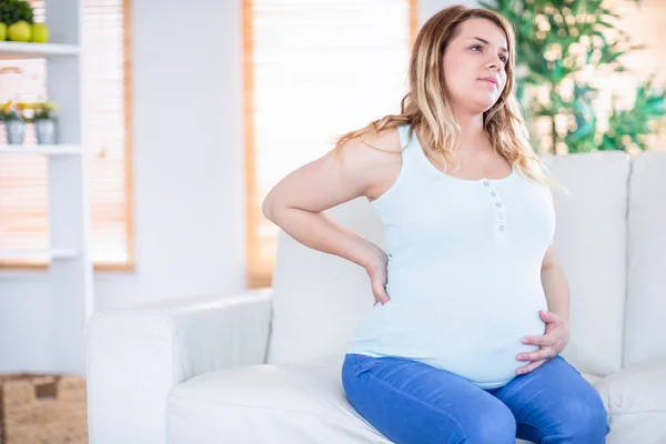 Gravid kvinna att få en sammandragning — Stockfoto