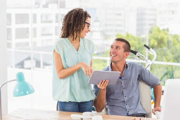 Creative business colleagues using a digital tablet — Stock Photo, Image