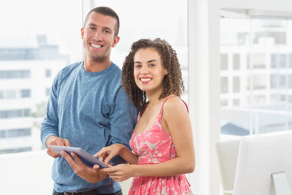 Creative business colleagues looking at the camera — Stock Photo, Image