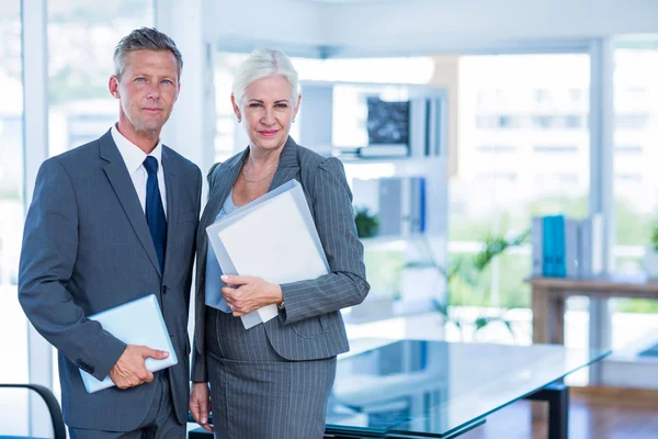 Happy business people holding shield — Stock Photo, Image