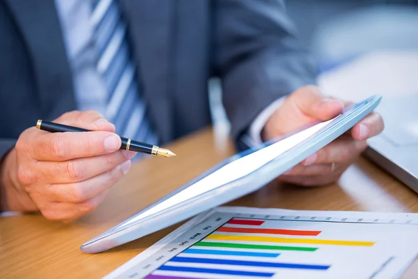 Businessman working on his digital tablet — Stock Photo, Image