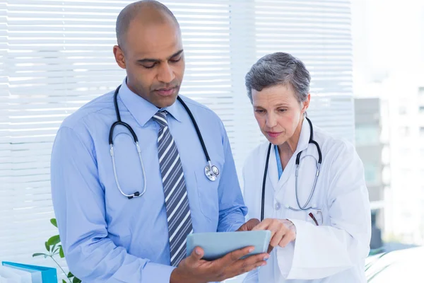 Medical colleagues working with tablet computer — Stock Photo, Image